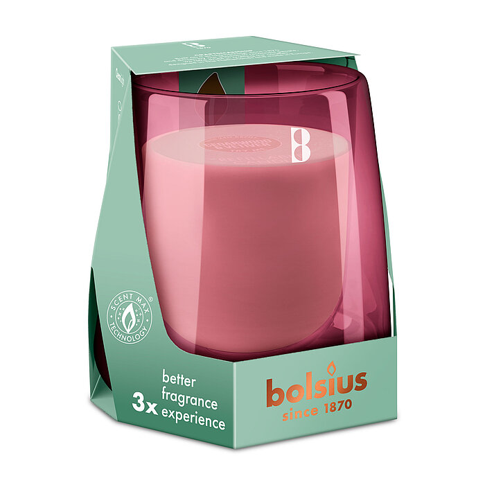 Ein Bolsius Cleanlight Starterkit bestehend aus einem rosa Glashalter und einer Duftkerze mit Zedernholz/Vetiver-Duft in einer stylischen grünen Verpackung mit Bolsius Schriftzug.